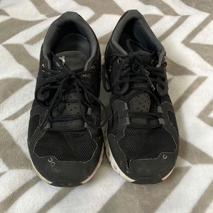 On Cloud shoes with some wear on the left toe